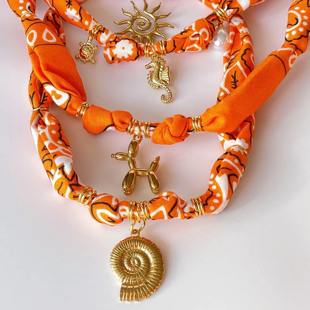 Orange Bandana Necklace with Gold Plated Charms – Sun, Dog, Heart & More – The Party Days | The Party Days