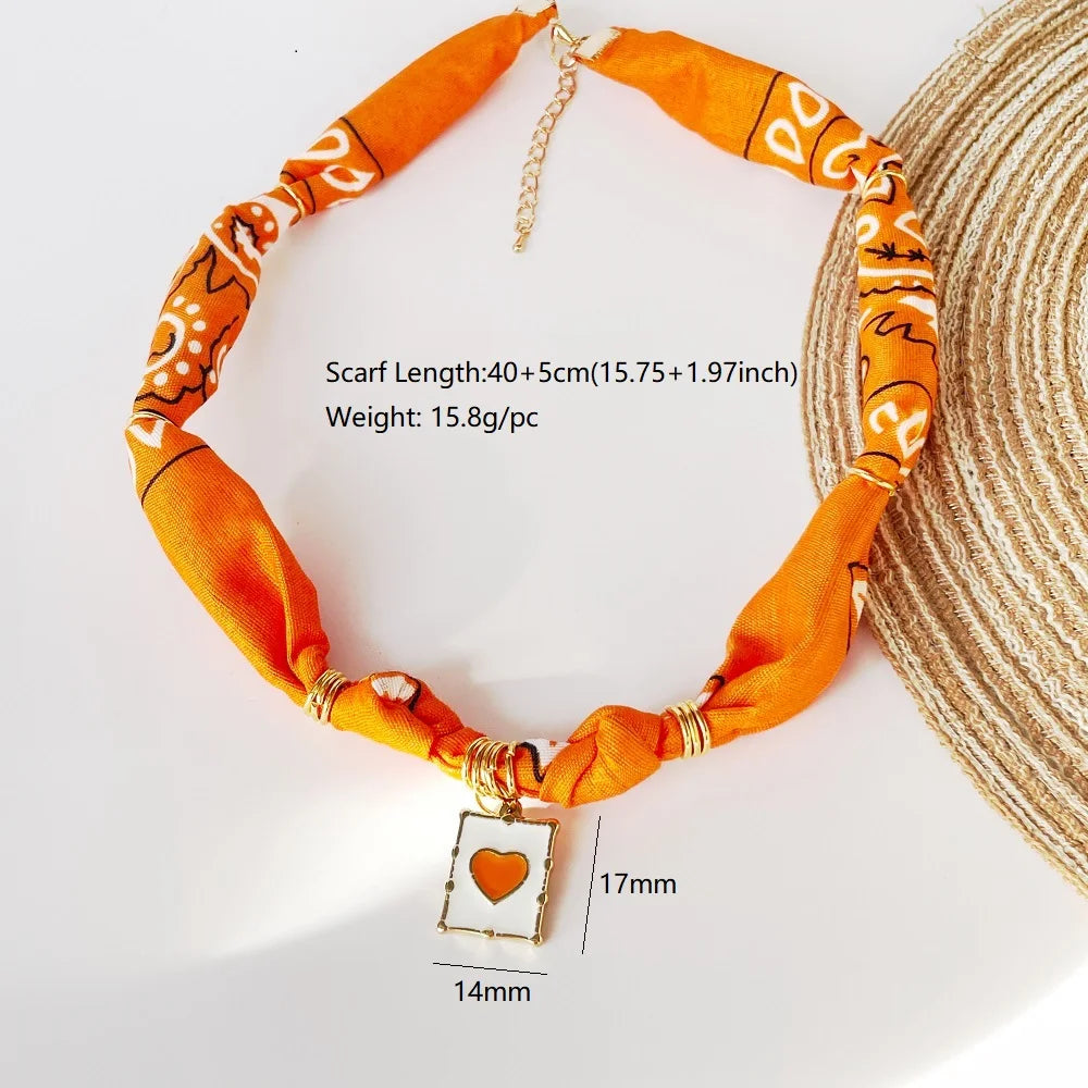 Orange Bandana Necklace with Gold Plated Charms – Sun, Dog, Heart & More – The Party Days | The Party Days